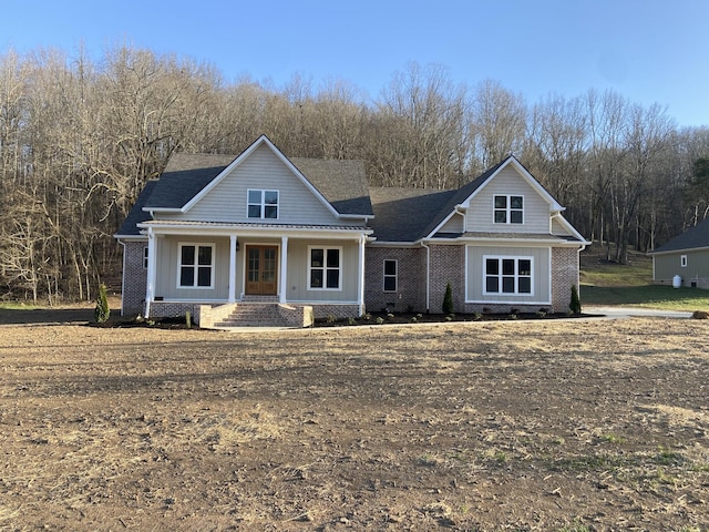 991 Scenic Dr, Pulaski, TN 38478 - view of front of property featuring a porch, board and batten siding, and brick siding