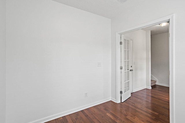 164 Ramsden Ave, La Vergne, TN 37086 - unfurnished room featuring french doors and dark wood-style flooring