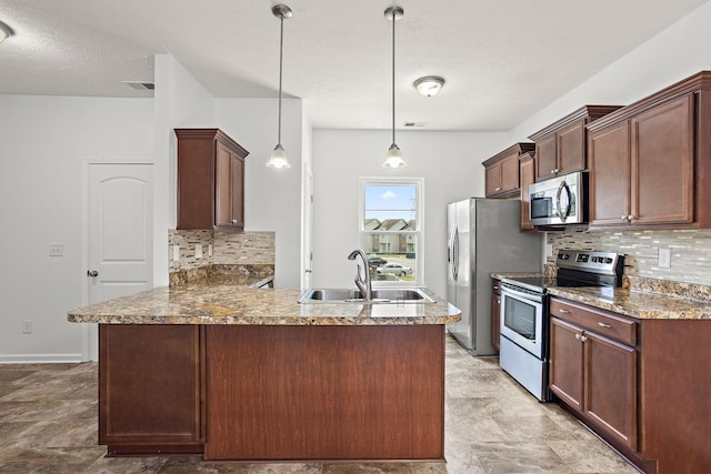 164 Ramsden Ave, La Vergne, TN 37086 - kitchen featuring appliances with stainless steel finishes, decorative backsplash, a peninsula, pendant lighting, and a textured ceiling