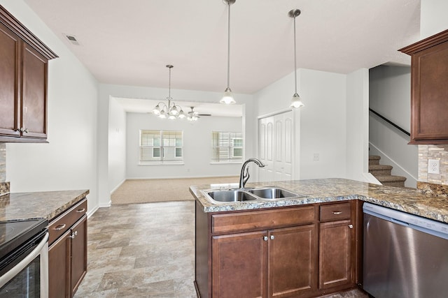 164 Ramsden Ave, La Vergne, TN 37086 - kitchen with appliances with stainless steel finishes, a chandelier, pendant lighting, a peninsula, and stone countertops