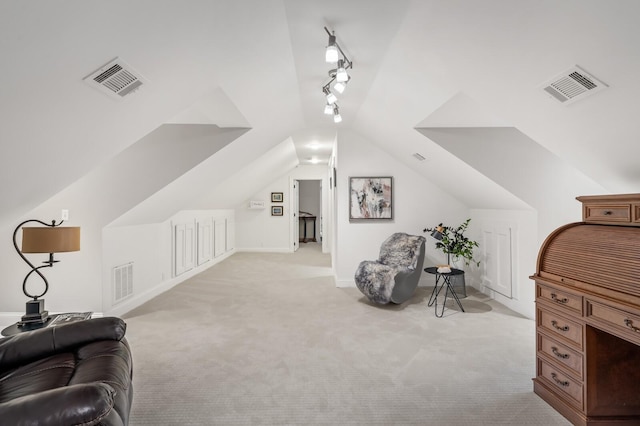 7871 Oscar Green Rd, Primm Springs, TN 38476 - living area featuring light carpet, rail lighting, and vaulted ceiling