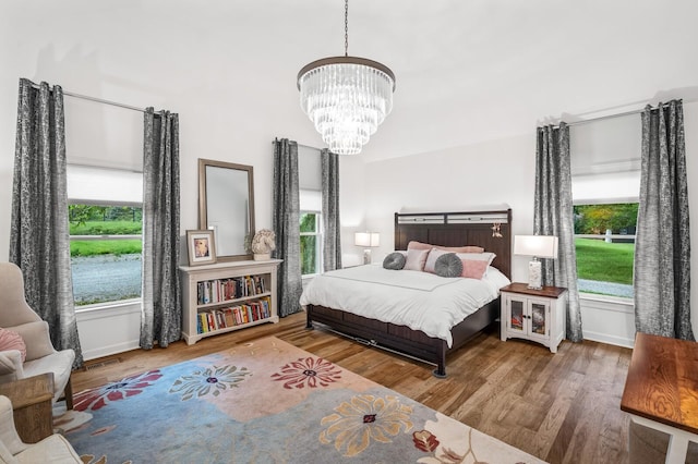 7871 Oscar Green Rd, Primm Springs, TN 38476 - bedroom with a chandelier and wood finished floors