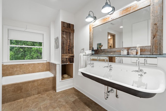7871 Oscar Green Rd, Primm Springs, TN 38476 - full bath featuring a relaxing tiled tub and baseboards