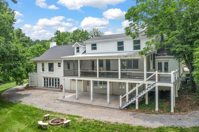 7871 Oscar Green Rd, Primm Springs, TN 38476 - back of house with french doors, a sunroom, a patio area, a chimney, and stairway