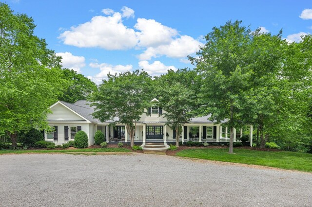 7871 Oscar Green Rd, Primm Springs, TN 38476 - obstructed view of property featuring a porch and a front lawn