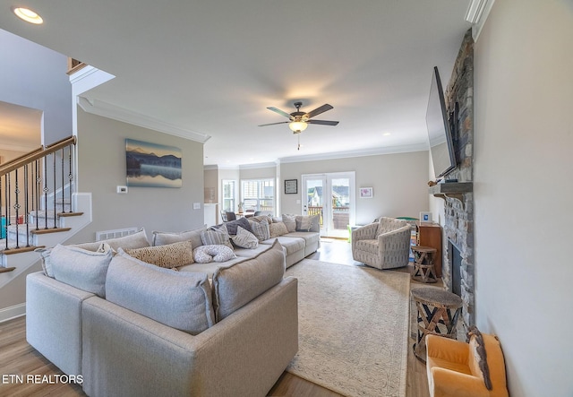 102 Chaseberry Rd, Oak Ridge, TN 37830 - living area with ornamental molding, a ceiling fan, wood finished floors, stairs, and a fireplace