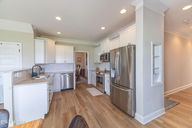 102 Chaseberry Rd, Oak Ridge, TN 37830 - kitchen with appliances with stainless steel finishes, crown molding, white cabinets, backsplash, and recessed lighting