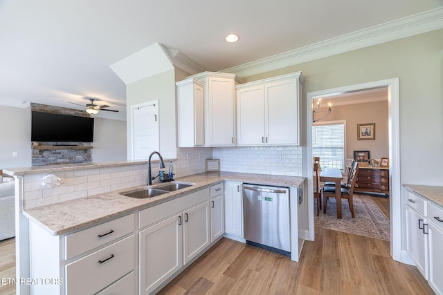 102 Chaseberry Rd, Oak Ridge, TN 37830 - kitchen with stainless steel dishwasher, ornamental molding, open floor plan, light wood-style flooring, and a peninsula