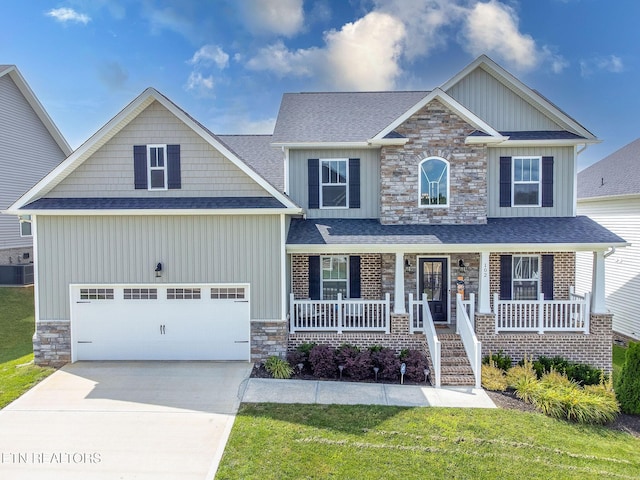 102 Chaseberry Rd, Oak Ridge, TN 37830 - craftsman-style home with board and batten siding, covered porch, driveway, and stone siding