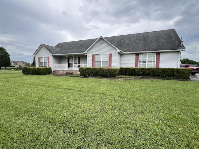 107 Cascade Ln, Bell Buckle, TN 37020 - single story home featuring covered porch, a front yard, and roof with shingles