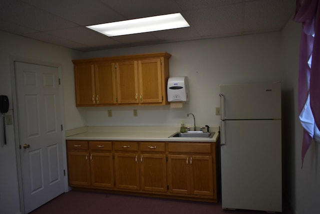 742 Lancaster Hwy, Lancaster, TN 38569 - kitchen with freestanding refrigerator, brown cabinets, a drop ceiling, and light countertops