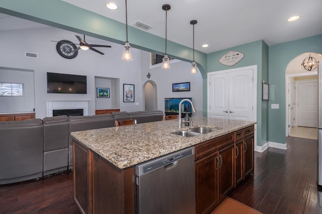 5407 Pisano St, Mount Juliet, TN 37122 - kitchen with arched walkways, dishwasher, ceiling fan, a fireplace, and dark wood finished floors