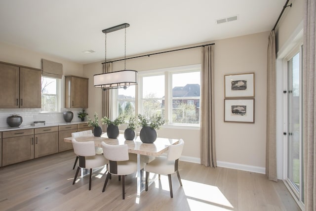 1935 Harmony Rd, Spring Hill, TN 37174 - dining space with light wood-style flooring and baseboards