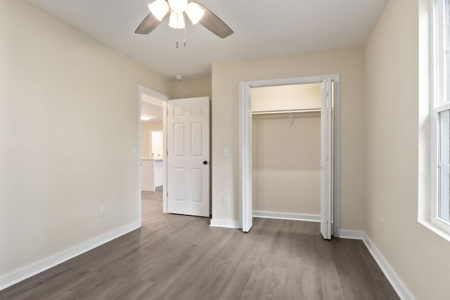 136 E School Dr, Rock Island, TN 38581 - unfurnished bedroom featuring wood finished floors, a closet, and a ceiling fan