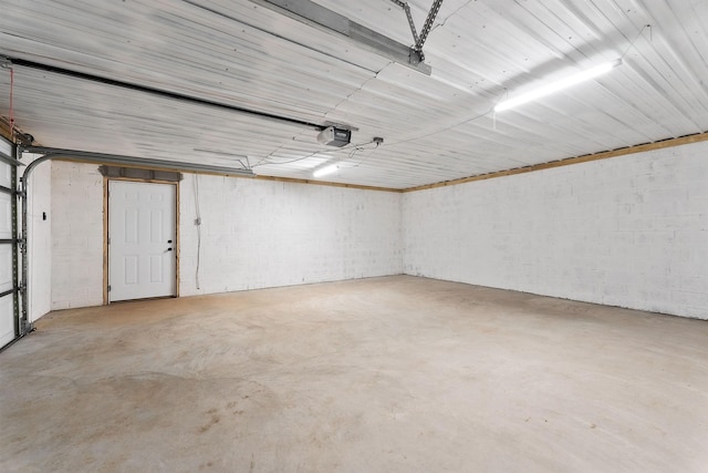 136 E School Dr, Rock Island, TN 38581 - garage with concrete block wall and a garage door opener