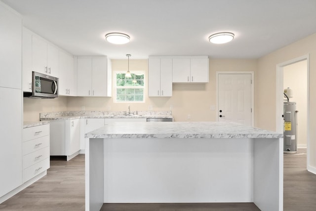 136 E School Dr, Rock Island, TN 38581 - kitchen with stainless steel appliances, water heater, light wood-style floors, and white cabinets