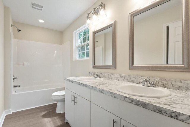 136 E School Dr, Rock Island, TN 38581 - bathroom featuring double vanity, wood finished floors, and shower / bath combination