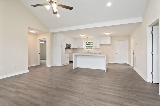 136 E School Dr, Rock Island, TN 38581 - kitchen featuring stainless steel microwave, a ceiling fan, white cabinetry, a kitchen island, and light countertops