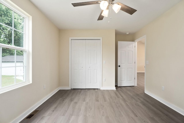 136 E School Dr, Rock Island, TN 38581 - unfurnished bedroom with wood finished floors, a closet, and a ceiling fan