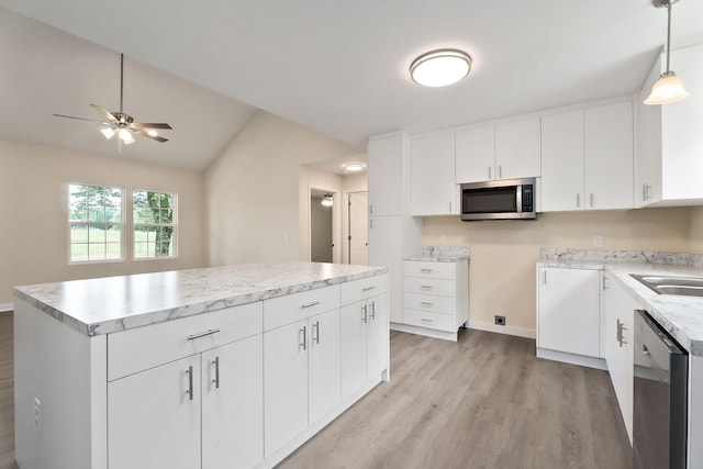 136 E School Dr, Rock Island, TN 38581 - kitchen with stainless steel appliances, light wood-type flooring, lofted ceiling, a kitchen island, and a ceiling fan
