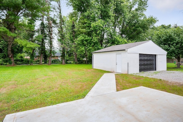 136 E School Dr, Rock Island, TN 38581 - view of green lawn with a garage, an outbuilding, and gravel driveway