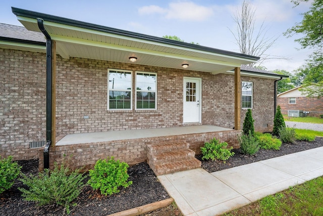 136 E School Dr, Rock Island, TN 38581 - doorway to property featuring a porch and brick siding