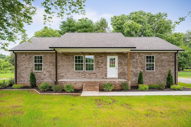 136 E School Dr, Rock Island, TN 38581 - view of front facade with roof with shingles, a front yard, and brick siding
