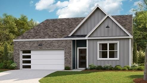 1306 Linn Cove Ct, Gallatin, TN 37066 - view of front of house with board and batten siding, brick siding, concrete driveway, and a front yard