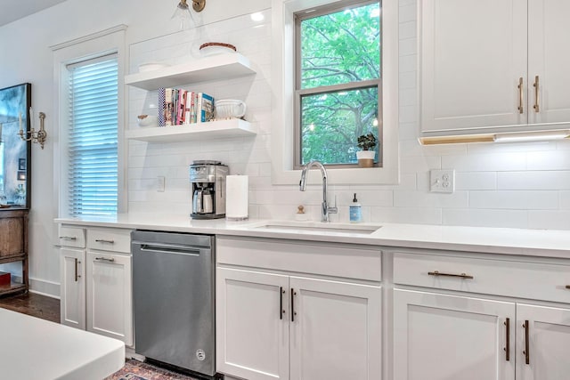 1510B 10th Ave N, Nashville, TN 37208 - kitchen featuring dishwasher, backsplash, light countertops, and white cabinetry
