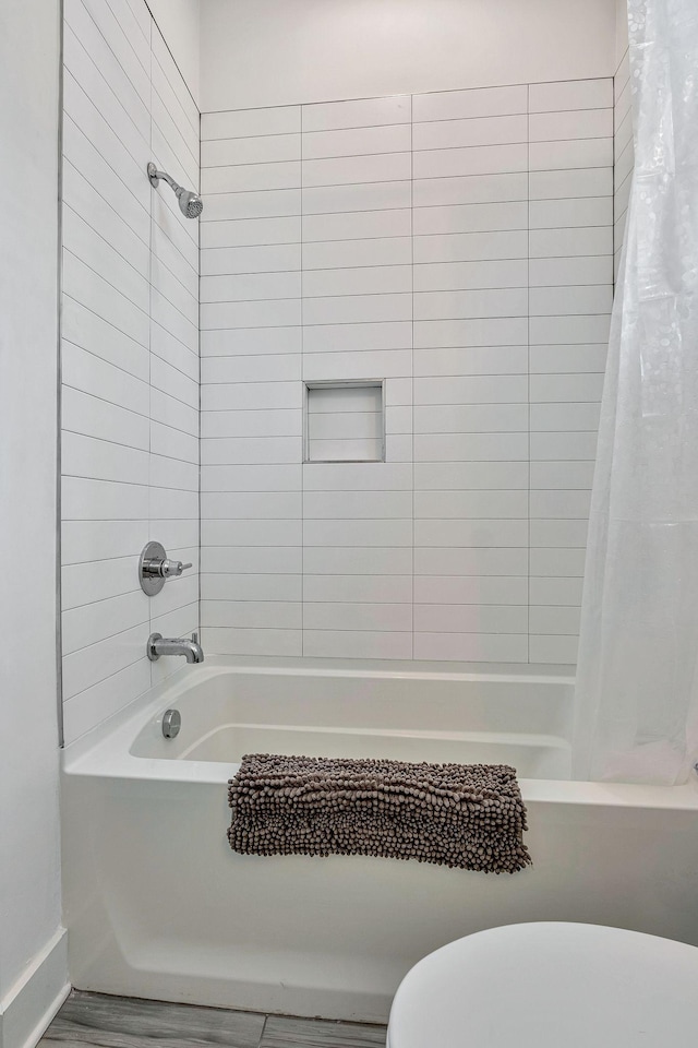 1510B 10th Ave N, Nashville, TN 37208 - bathroom with shower / tub combo and wood finished floors