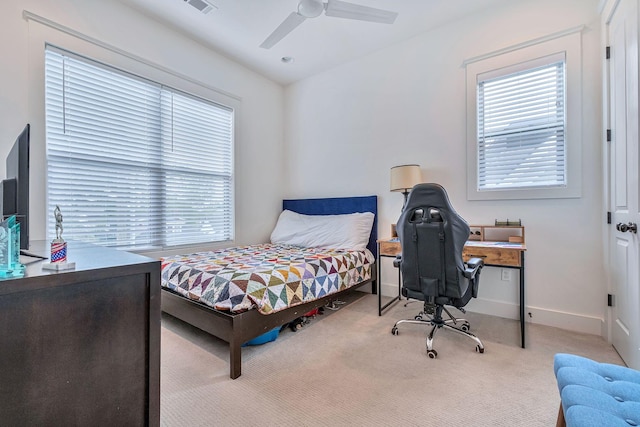 1510B 10th Ave N, Nashville, TN 37208 - carpeted bedroom featuring multiple windows, a desk, and a ceiling fan