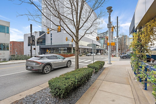 1212 Laurel St Unit 1510, Nashville, TN 37203 - view of asphalt road with sidewalks, traffic lights, curbs, street lights, and traffic signs