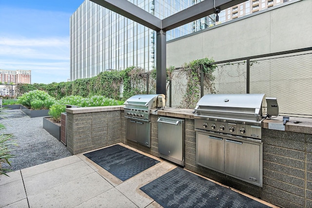 1212 Laurel St Unit 1510, Nashville, TN 37203 - view of patio featuring an outdoor kitchen