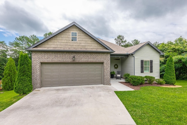 8624 Reba Ln, Hixson, TN 37343 - ranch-style home featuring brick siding, an attached garage, concrete driveway, and a front lawn