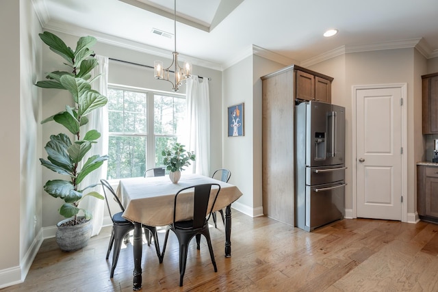 8624 Reba Ln, Hixson, TN 37343 - dining space featuring light wood-style flooring, a chandelier, crown molding, and recessed lighting