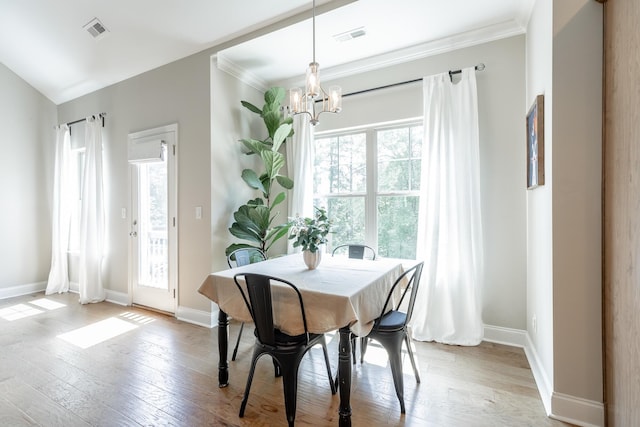 8624 Reba Ln, Hixson, TN 37343 - dining space featuring a chandelier, hardwood / wood-style flooring, and crown molding