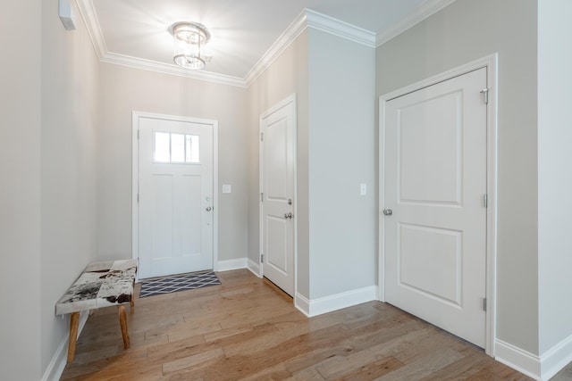 8624 Reba Ln, Hixson, TN 37343 - foyer entrance featuring ornamental molding, light wood-style flooring, and a chandelier