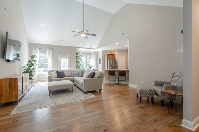 8624 Reba Ln, Hixson, TN 37343 - living room with ceiling fan, light wood finished floors, and high vaulted ceiling