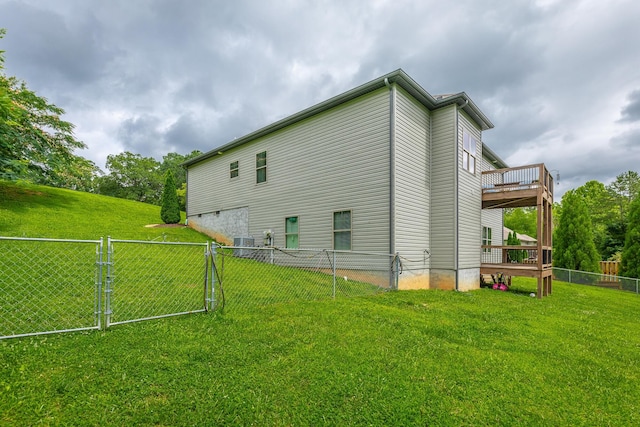 8624 Reba Ln, Hixson, TN 37343 - view of side of home featuring a fenced backyard, a gate, and a wooden deck