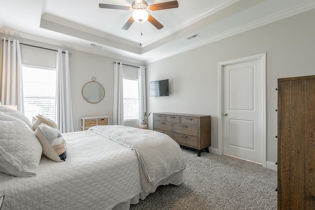 8624 Reba Ln, Hixson, TN 37343 - carpeted bedroom with ornamental molding, a tray ceiling, and a ceiling fan