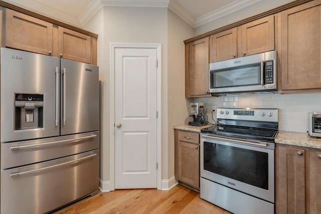8624 Reba Ln, Hixson, TN 37343 - kitchen with stainless steel appliances, ornamental molding, light wood-type flooring, brown cabinetry, and tasteful backsplash