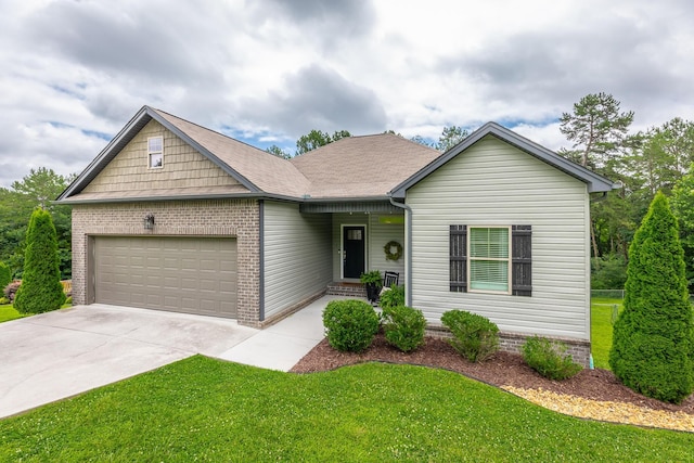 8624 Reba Ln, Hixson, TN 37343 - view of front of home with a garage, a front yard, driveway, and brick siding