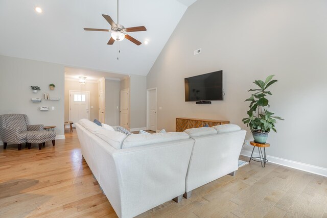 8624 Reba Ln, Hixson, TN 37343 - living room with high vaulted ceiling, a ceiling fan, and light wood-style floors