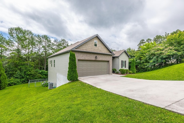 8624 Reba Ln, Hixson, TN 37343 - view of front of property with a front lawn, concrete driveway, an attached garage, and brick siding