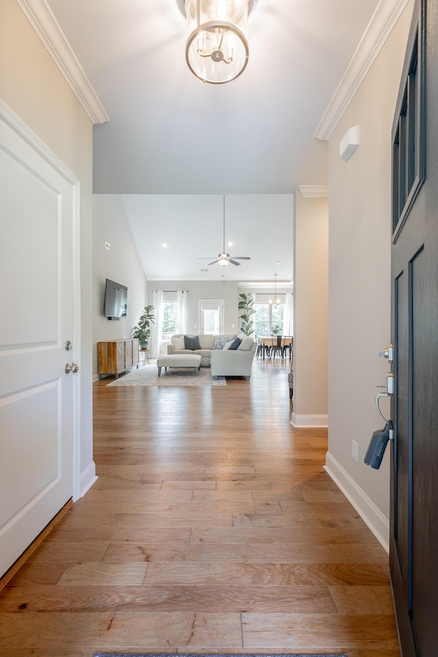 8624 Reba Ln, Hixson, TN 37343 - entryway featuring light wood-style floors, a chandelier, a ceiling fan, crown molding, and lofted ceiling