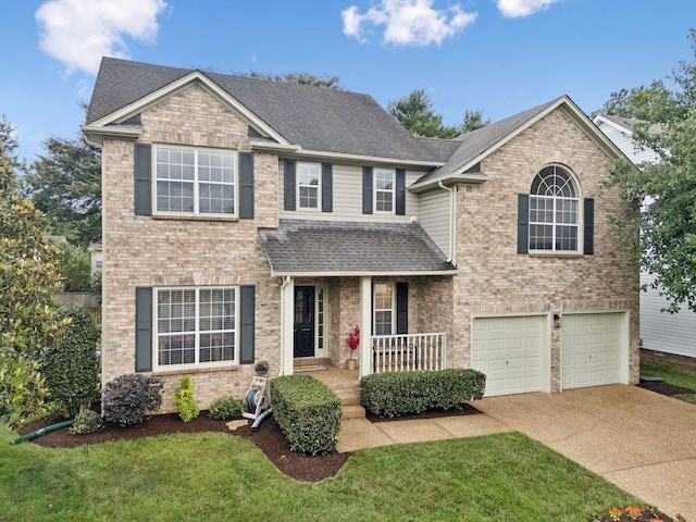 368 Cannonade Cir, Franklin, TN 37069 - traditional-style house with a porch, brick siding, concrete driveway, and an attached garage