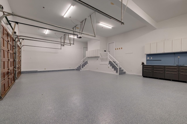 1825 Lake Meadow Trl, Mount Juliet, TN 37122 - garage featuring baseboards and a garage door opener