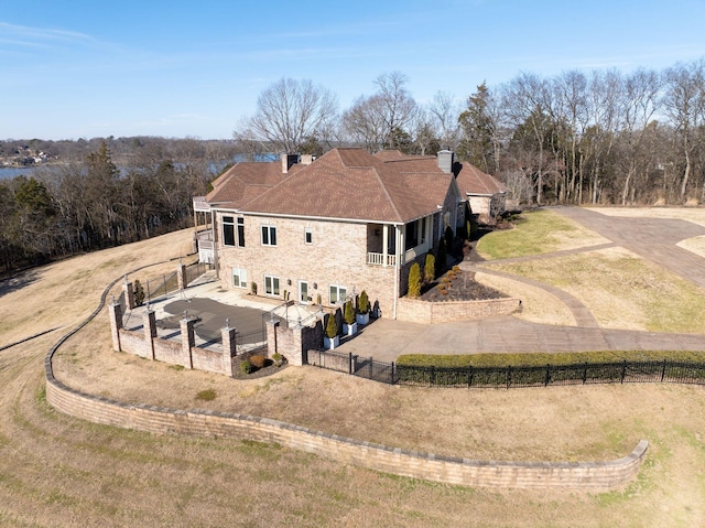 1825 Lake Meadow Trl, Mount Juliet, TN 37122 - rear view of property featuring a chimney and a fenced backyard