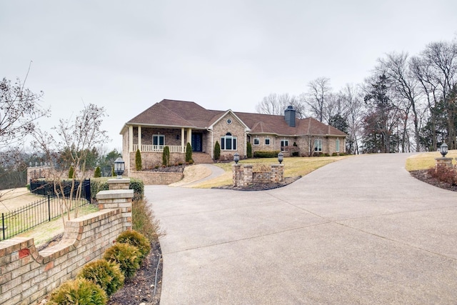 1825 Lake Meadow Trl, Mount Juliet, TN 37122 - view of front of property with a chimney, brick siding, and driveway