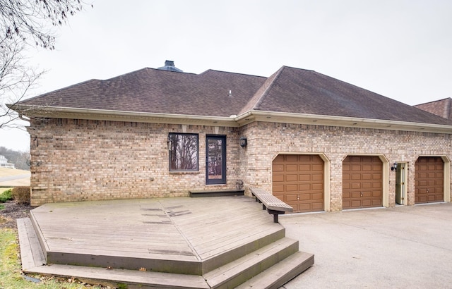 1825 Lake Meadow Trl, Mount Juliet, TN 37122 - view of front of house with roof with shingles, brick siding, an attached garage, and a chimney